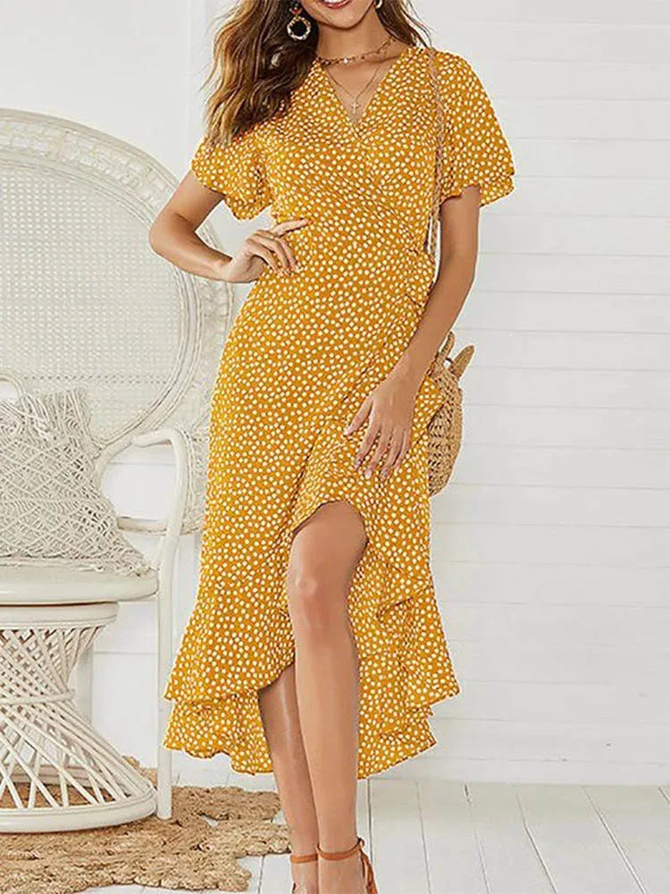 Vestido longo com estampa floral. Decote em V e fendas sexy.