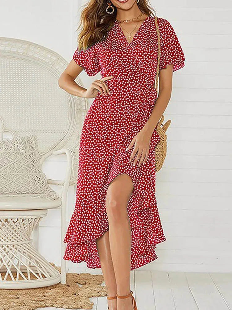 Vestido longo com estampa floral. Decote em V e fendas sexy.